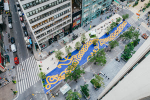 A 250-foot long street art mural is unveiled in the Garment District