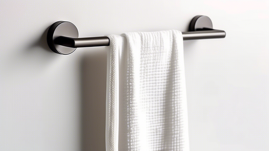 A sleek and modern magnetic kitchen towel holder mounted on a metallic wall with a white, absorbent Turkish cotton towel draped over it, casting a soft shadow on the wall. The holder should be simple 